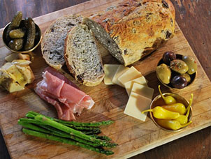 fresh bread, brie and salami cheese board