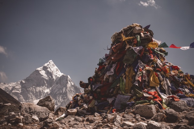 piles of trash under a mountain