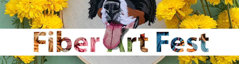 emberoidered dog with over-hanging tongue and fiber art fest logo